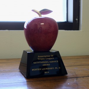The Red Apple statuette has been presented to every winner of the Leagues' award since 1997.