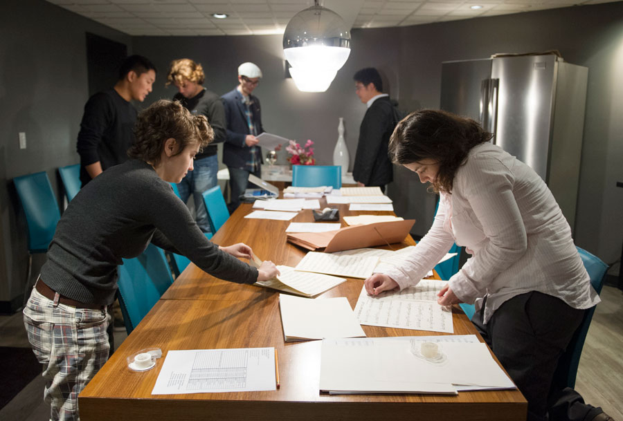 SMPTV students tape together parts and scores for the USC Thornton Jazz Orchestra   (Photo/Chandler Golan)