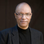 Formal portrait of Billy Childs dressed in black