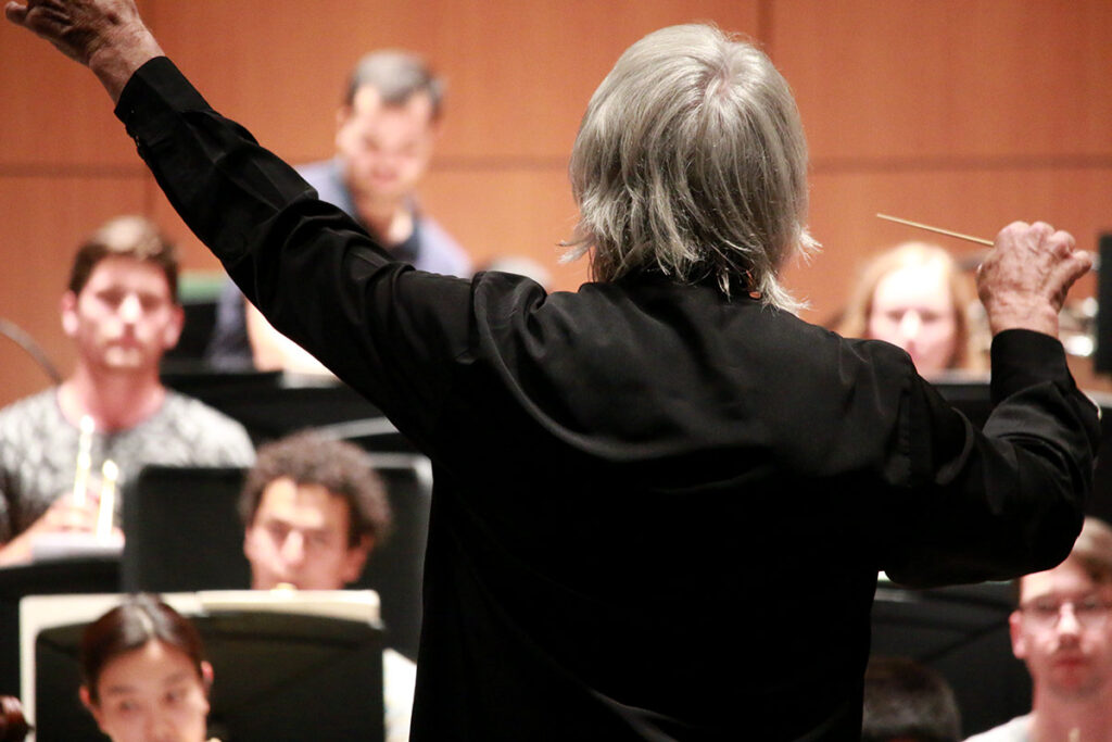Maestro Carl St.Clair leads the symphony in a rehearsal of Mussorgsky's “Pictures at an Exhibition.” (Photo/Daniel Anderson)