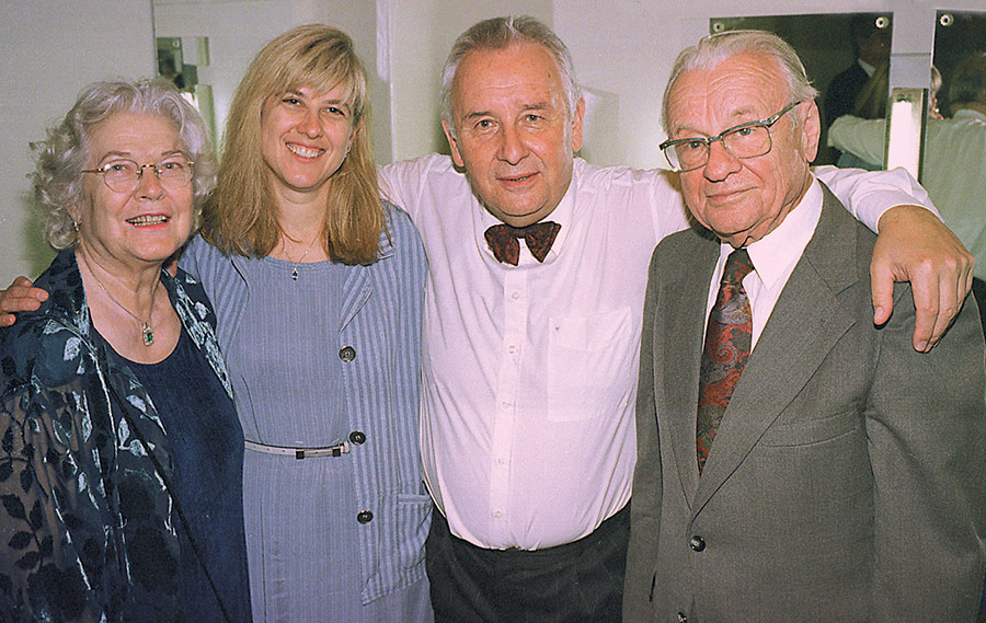 Gorecki embraces the Wilk family – Wanda (left), her daughter, Diane (center), and husband, Stefan (right).