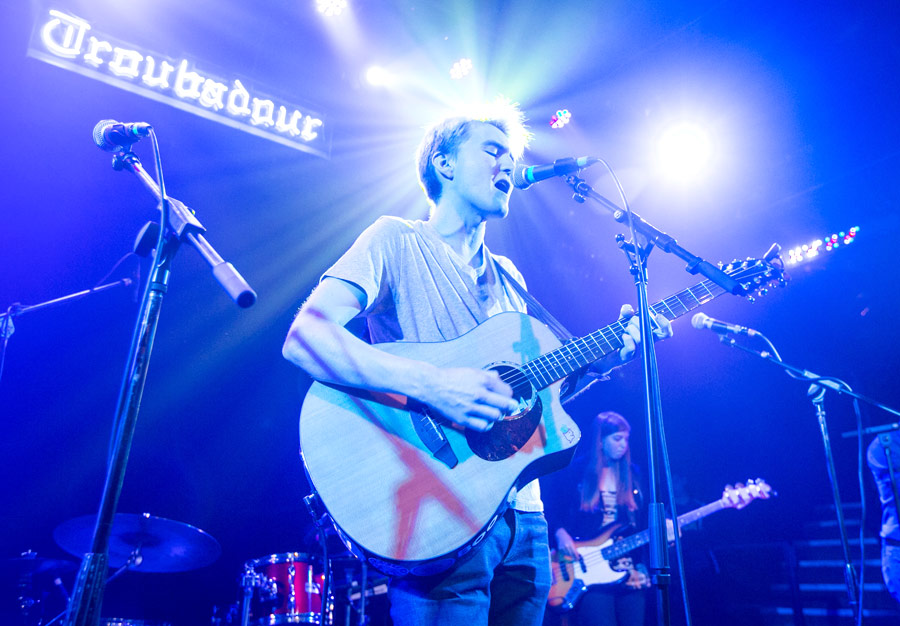 Singer Chase Kroesche performs under the often-photographed Troubadour neon sign. Emily Rosenfield plays bass at right. (USC Photo/David Sprague)