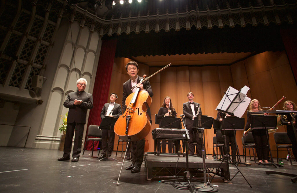 Cellist Li-Wei Qin performed Friedrich Gulda’s Concerto for Cello and Wind Orchestra with the USC Thornton Wind Ensemble, under conductor Uriel Segal at USC’s Bovard Auditorium on May 19. (Photo by Dario Griffin/USC)