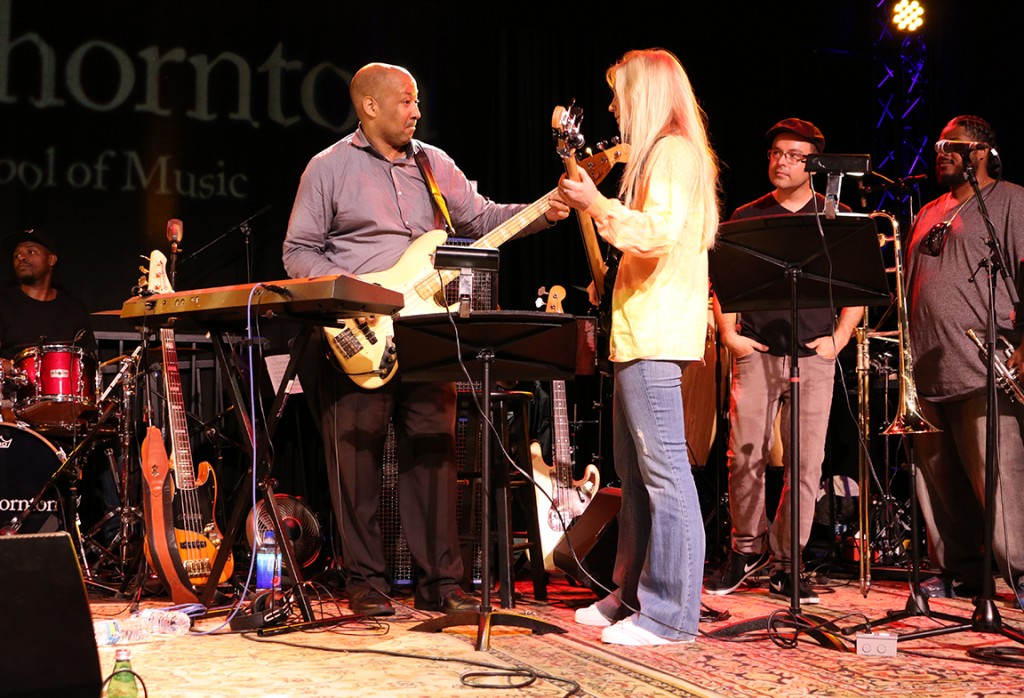 Bassist Alex Al teaching the iconic bass line to Chic’s “Good Times” to student Christine Meisenhelter.