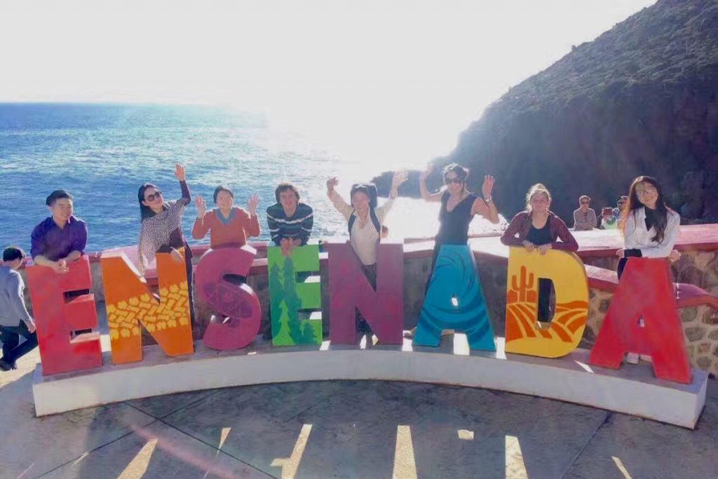 The group poses in front of the Ensenada sign. (Photo courtesy of Chang He)