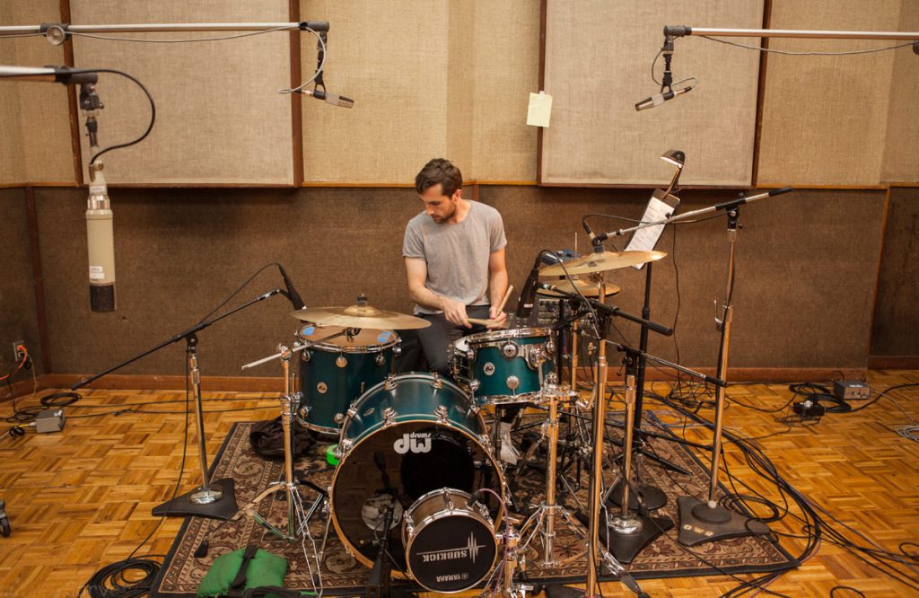 Popular Music drummer Carter Couron setting up.