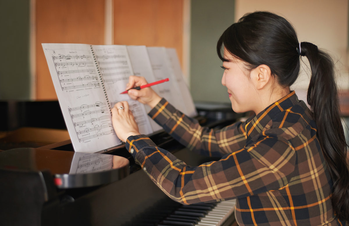 female composer at piano