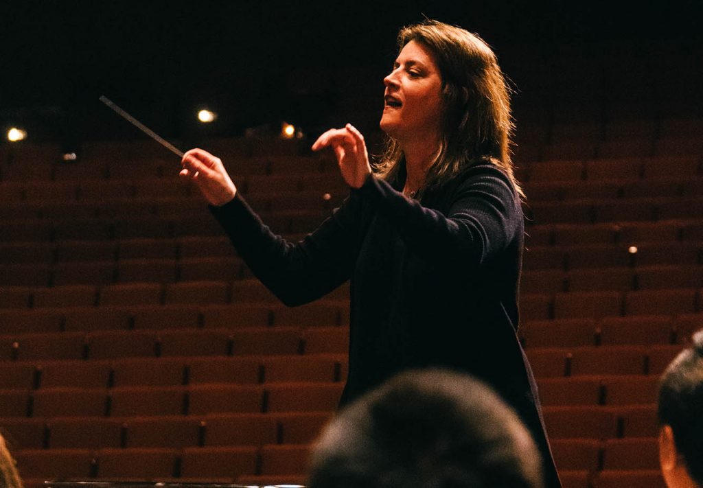 Sharon Lavery lead the USC Thornton Wind Ensemble at CBDNA 2019. (Photo by Chris O'Brien)