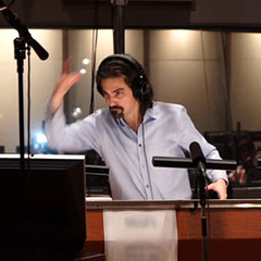 Photo of Bear McCreary in studio, conducting