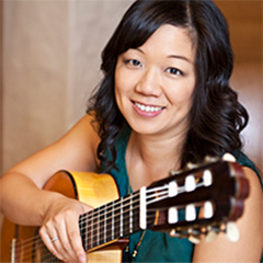 Photo of Connie Sheu with guitar