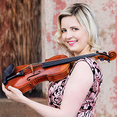 Photo of Kathryn Eberle holding violin