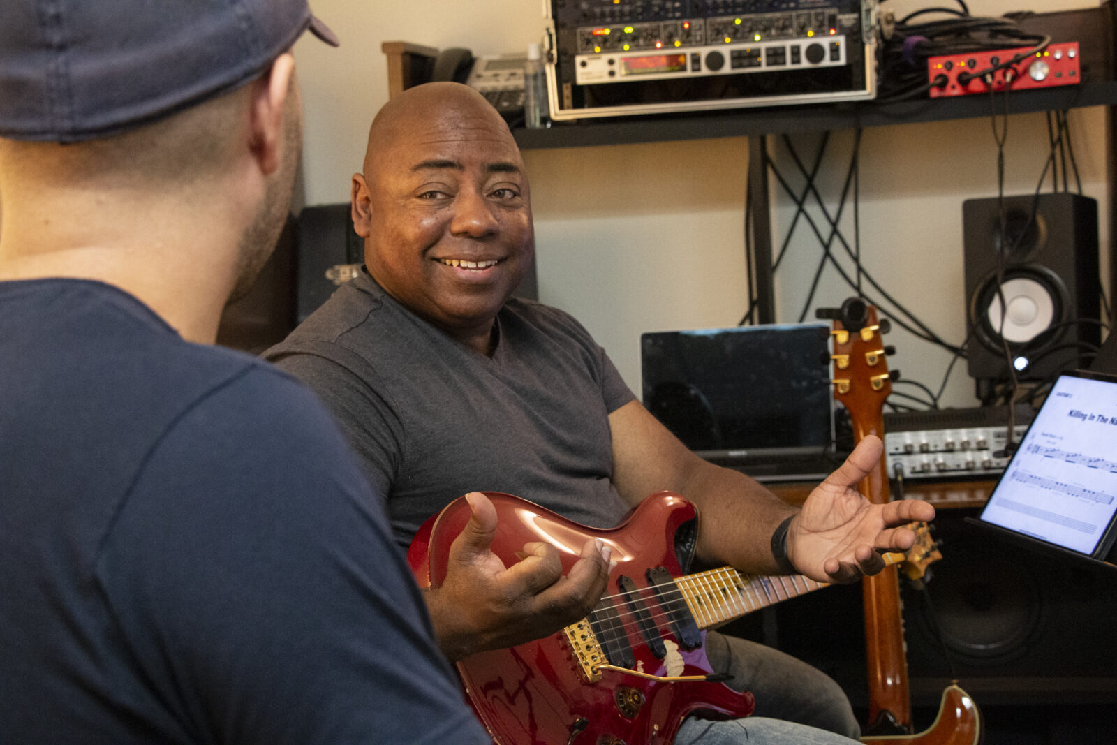 Photo of Paul Jackson Jr. teaching a student 