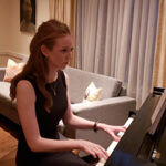 Photo of Erna Vala at piano