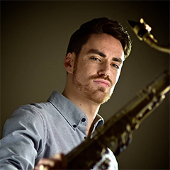 Photo of Daniel Weidlein holding saxophone