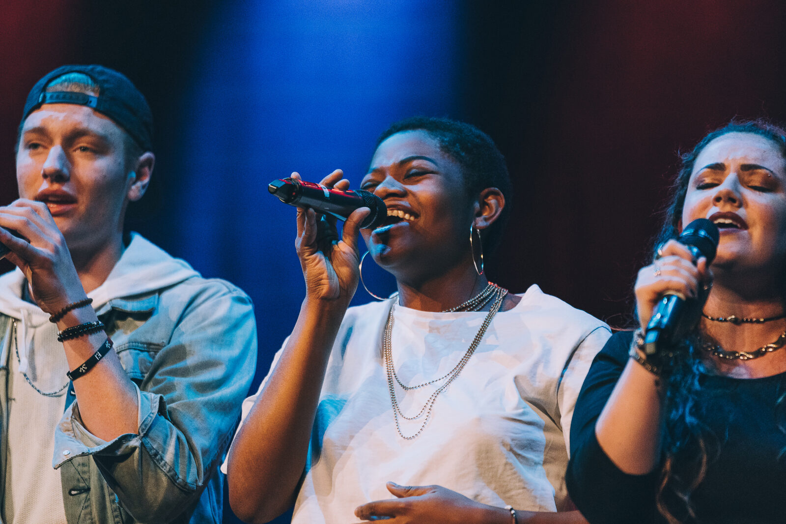 Tehillah Alphonso singing on stage 