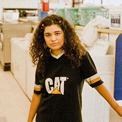 Remi Wolf photographed in a laundromat