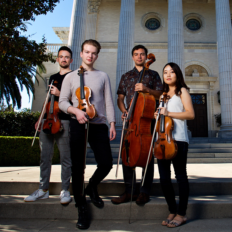 group of strings musicians outdoors with instruments