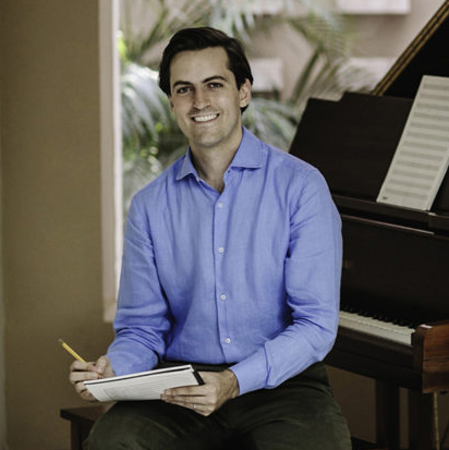 Juan Pablo Contreras holding notepad and pencil