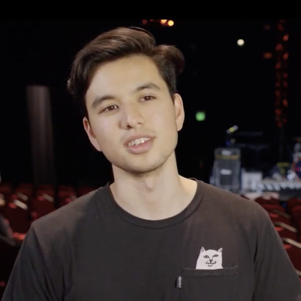 Luca Mendoza in black shirt facing camera