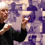 Carl St.Clair holding conducting baton, with tiled Zoom images in the background