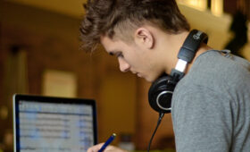 Student with headphones studying