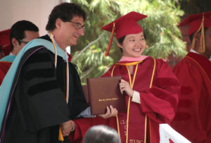 Robert Cutietta, dean of the USC Thornton School of Music, Robert Cutietta, congratulates a graduating student in 2017