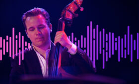 Photo of jazz bassist with sound wave illustration