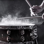 Snare drum played in close up with dramatic lighting