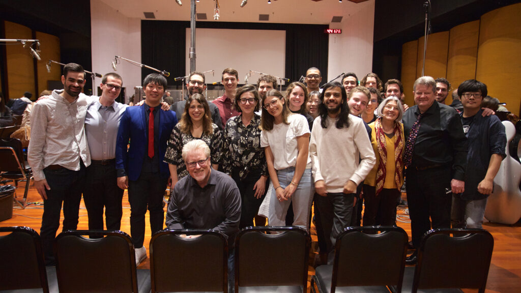 Daniel Carlin poses for a picture with his students and Pete Anthony at the Warner Bros. Eastwood Scoring Stage.  