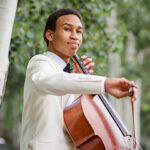 Photo of Quenton Blache playing the cello