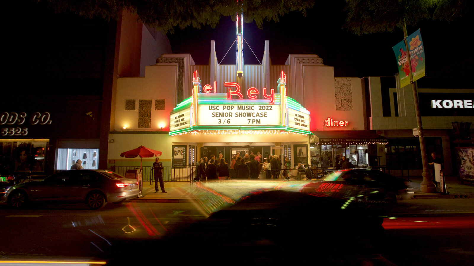 Photo of a theatre marquee lit up at night. 