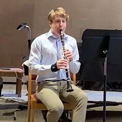 Photo of Andres Peterson playing the clarinet