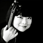 Photo of Yura Lee holding a viola