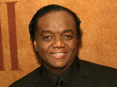 Photo of Lamont Dozier attending an event in concert attire.