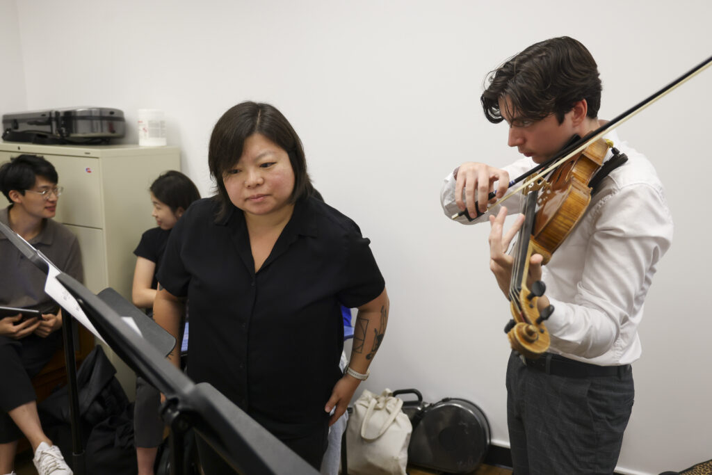 Photo of Yura Lee teaching a violin student during a studio class at USC Thornton.