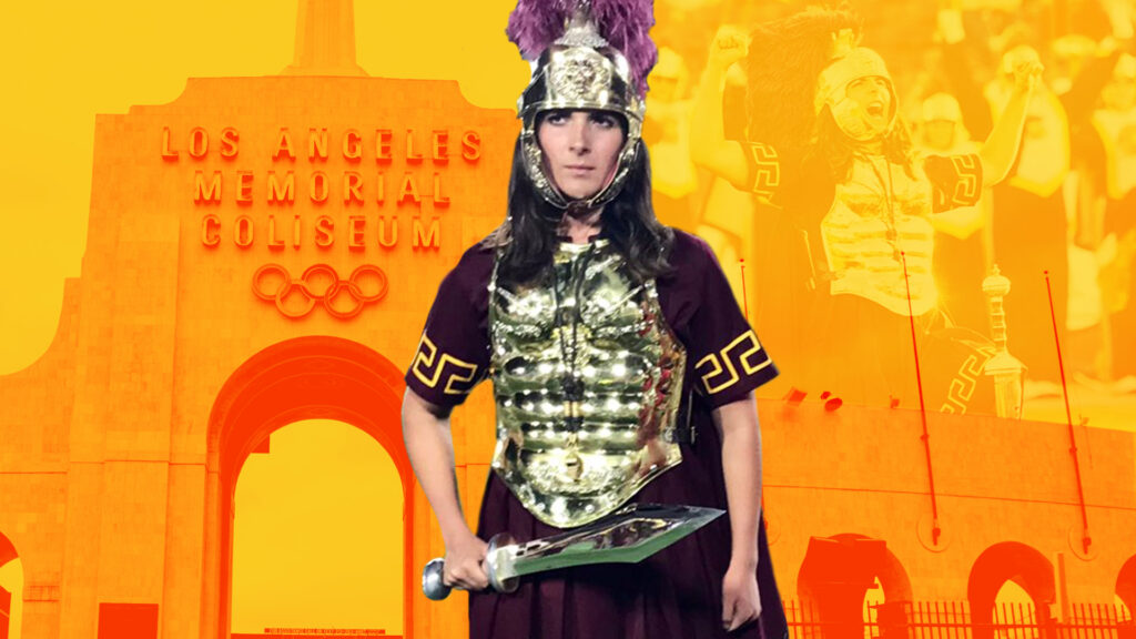 Photo of a marching band drum major dressed like a Trojan warrior in gold armor.