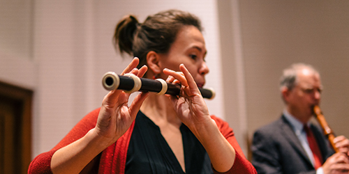 Photo of a student playing an early music flute.