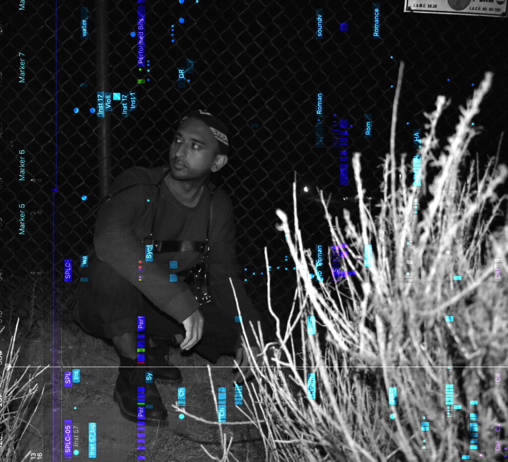 A music performer crouches down outside at night next to desert plants surrounded by digital music illustrations.