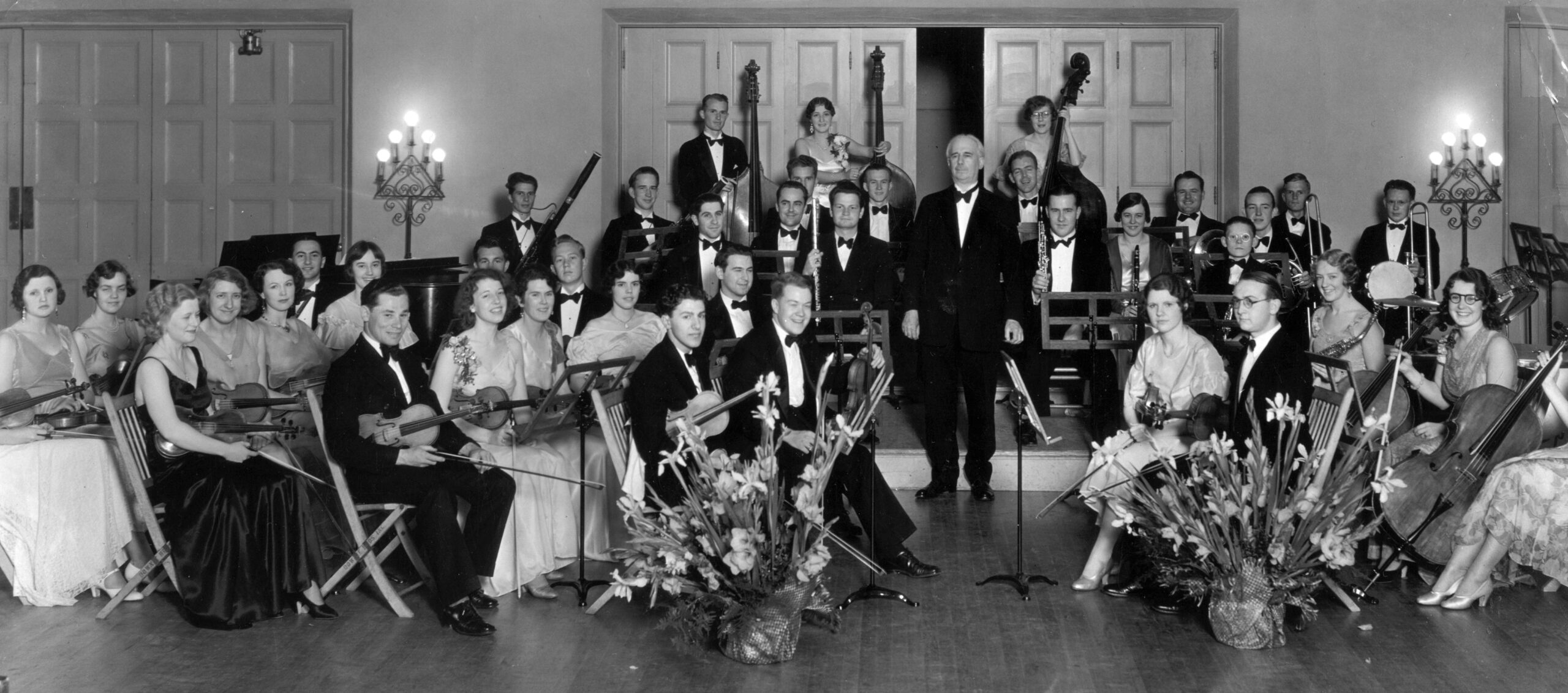 1932: Alexander Stewart conducts the USC Symphony Orchestra.