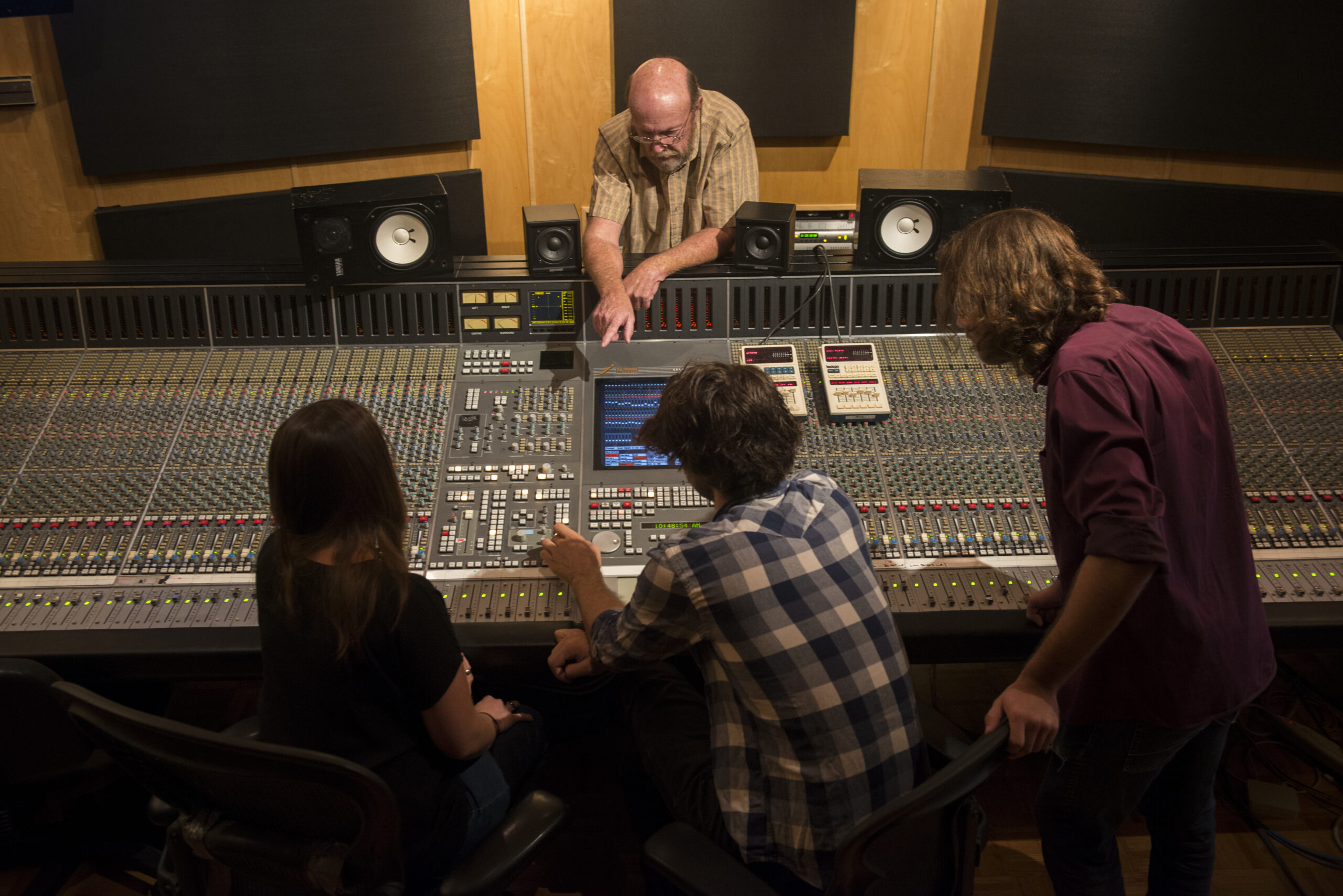 2015: USC Thornton Music Technology professor Richard McIlvery guides a student through learning about a modern recording studio.