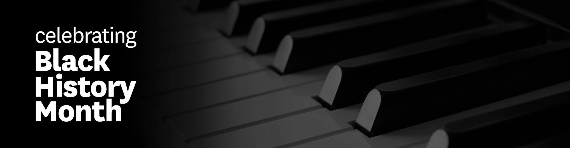 Black and white photo of piano keys.