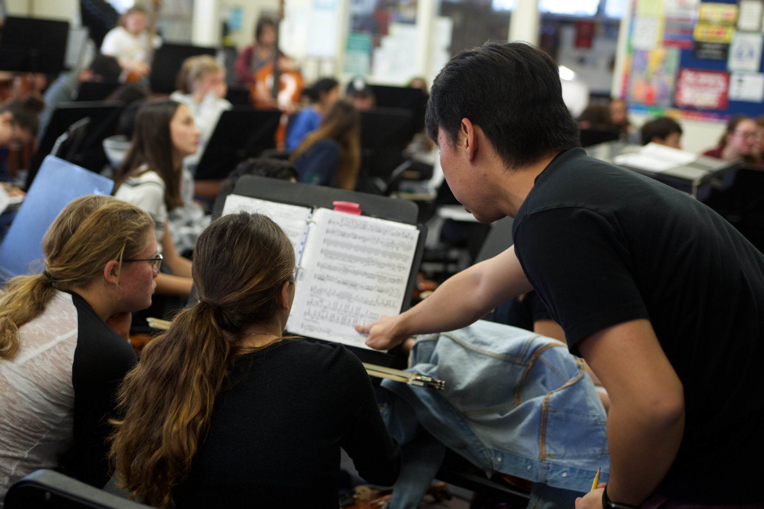 Jim Wang provides music instruction to youth.