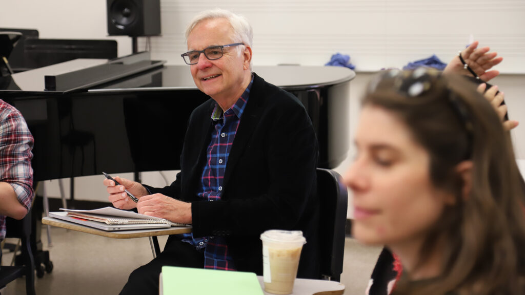 Photo of Ken Foster leading a discussion within an indoor classroom.