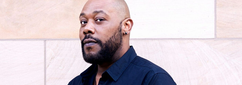 Photo of opera singer Derrick Lawrence, new faculty at USC Thornton, smiling at the camera.