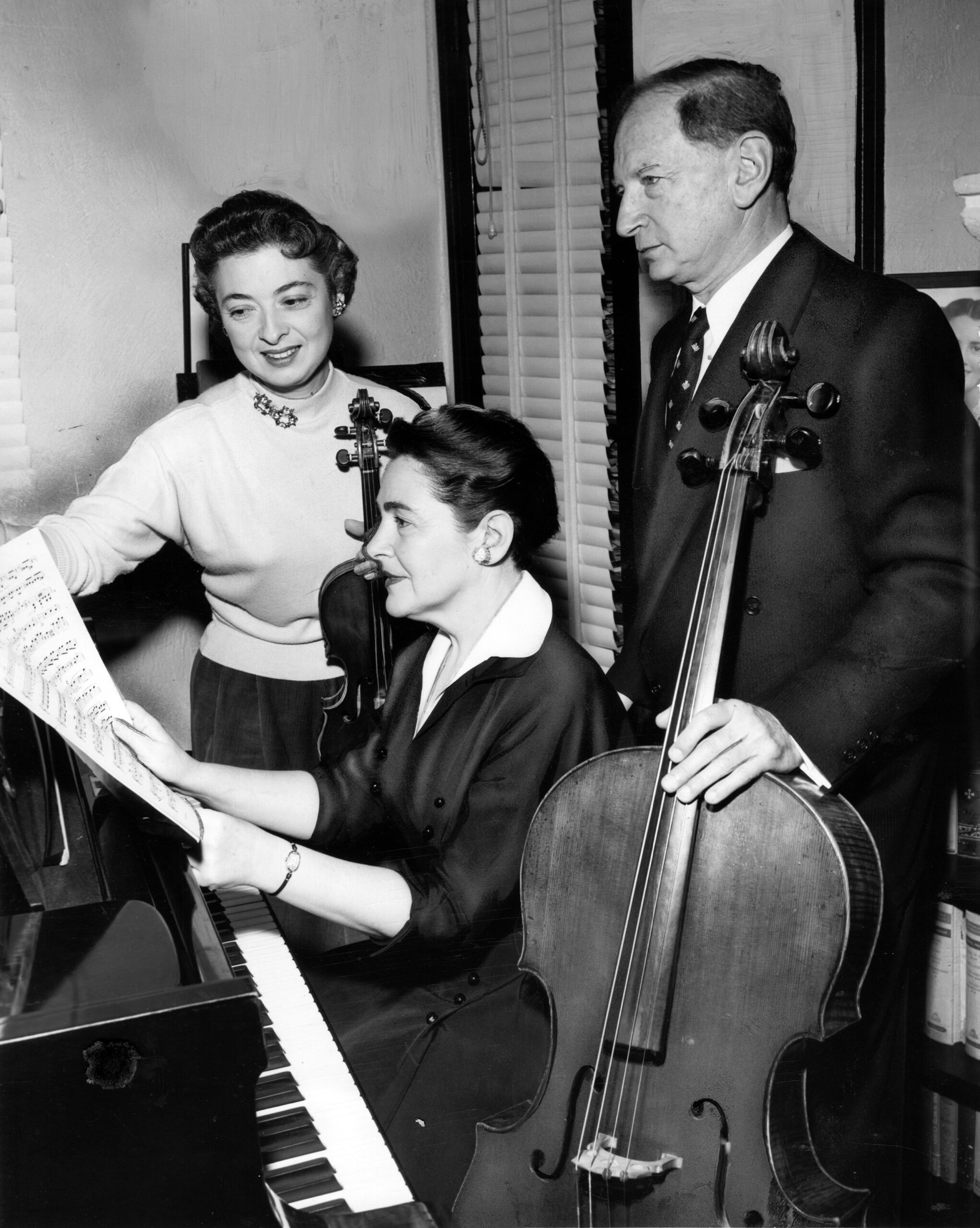 Black & white photo from the 1940s of Eudice Shapiro with Joanna and Nikolai Graudan. 