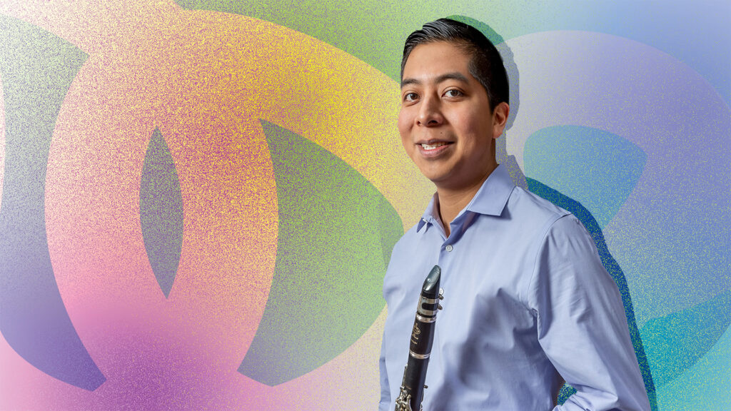 Photo of Javier Morales-Martinez holding a clarinet in front of a colorful illustrated background.