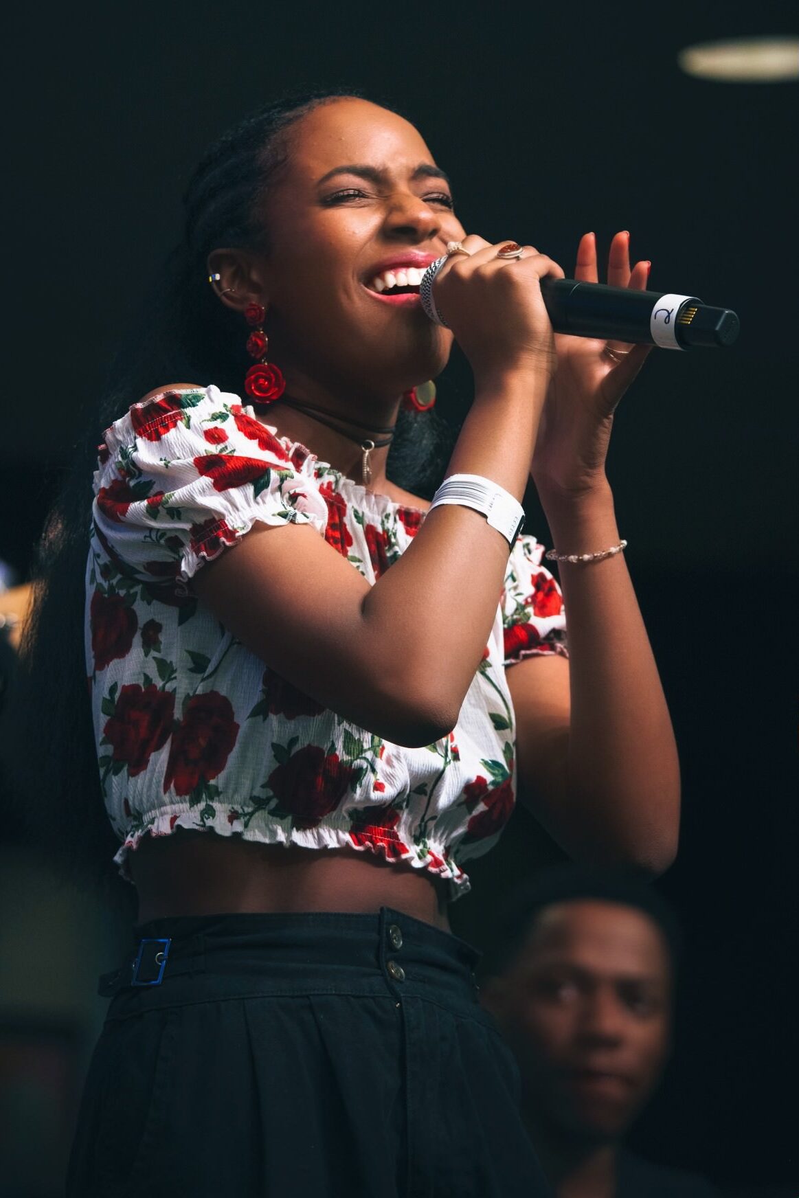 A pop singer performs on stage.
