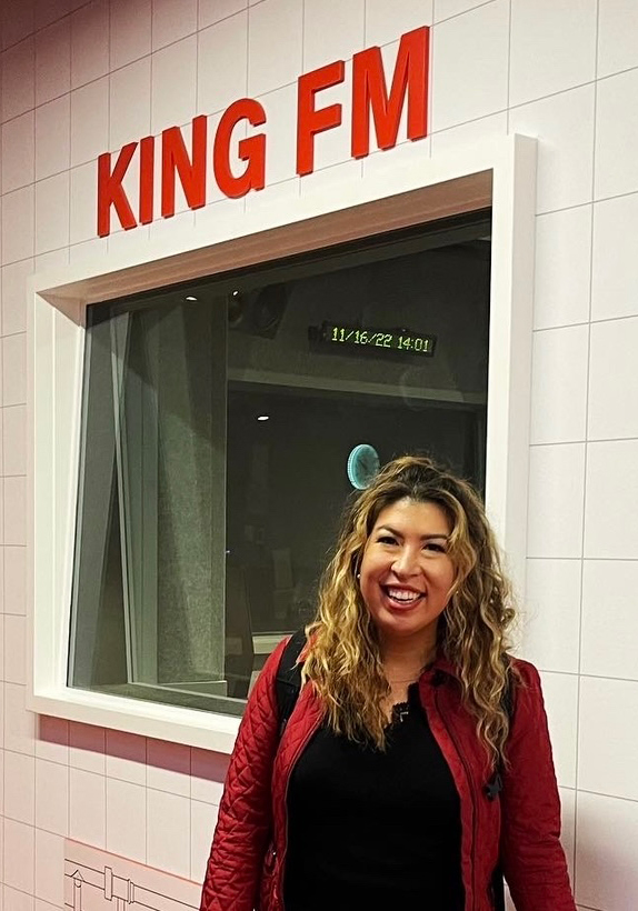 Photo of Michelle Maestas Simonsen inside of a radio station.