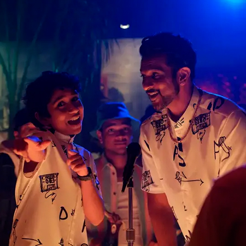 Screenshot of a scene from the film "World's Best" with a young person and a middle aged person in a club.