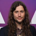 Photograph of composer Ludwig Goransson smiling at an awards show.
